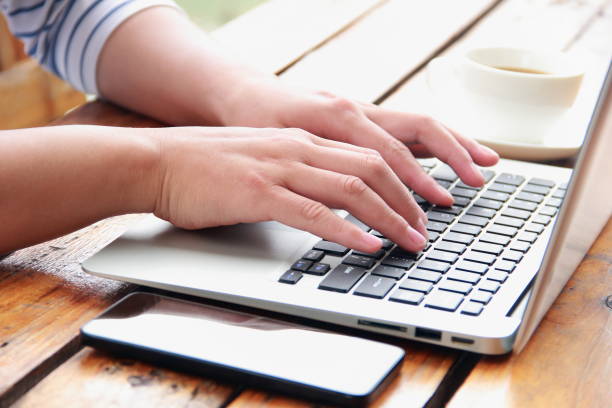 istock Female hand typing with laptop 845470822