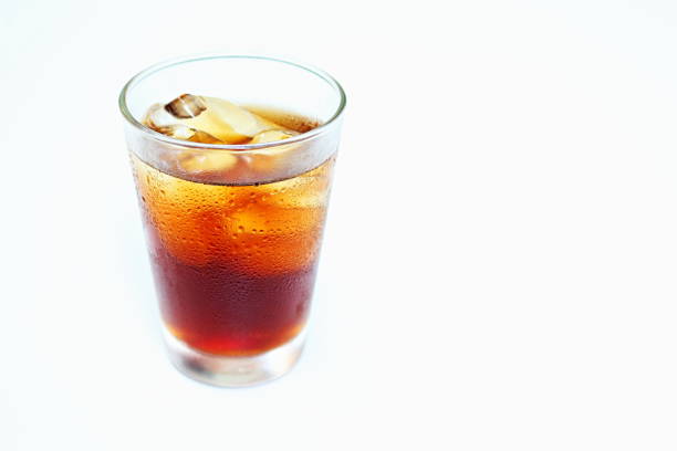 Glass of sparkling cola water isolated on white background.