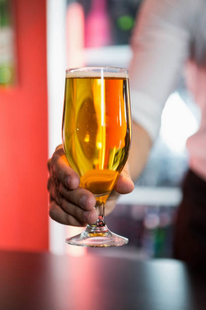 istock Bartender serving a glass of beer 845473870