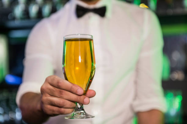 istock Bartender serving a glass of beer 845474042