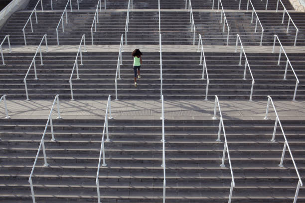 istock Athletic woman exercise running upstairs on stadium. 845479818