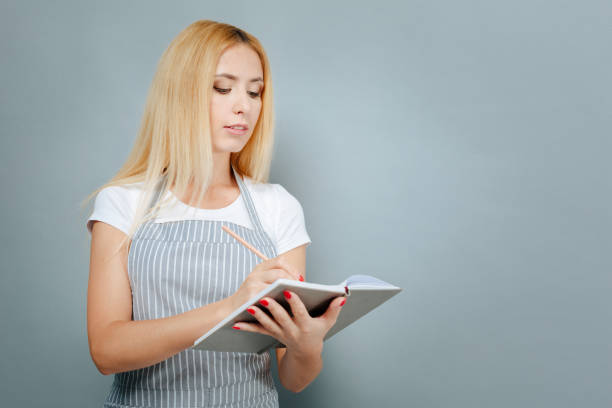 istock Attentive young woman looking downwards 845482770