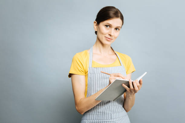 istock Amazing brunette posing on camera in apron 845484090