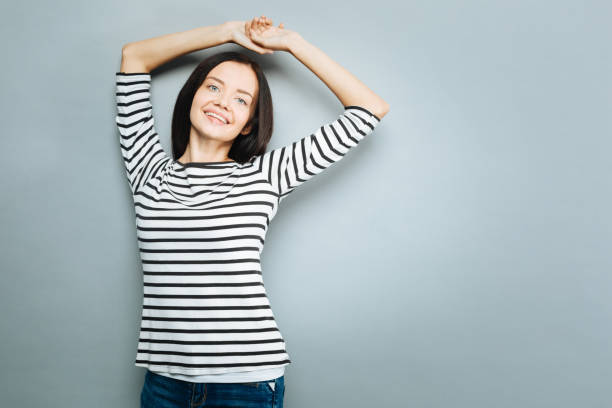 istock Charming female raising arms over head 845486566