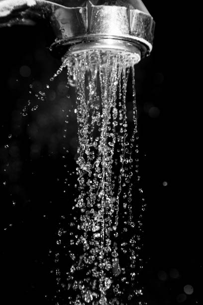 istock Shower with water isolated on a black background 845487398