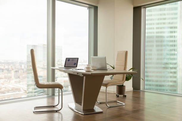 istock Modern company manager workplace in bright office 845490490
