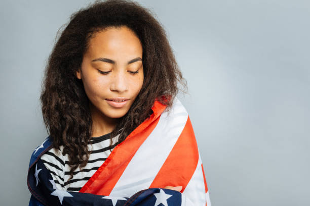 istock Attractive international girl looking downwards 845490564