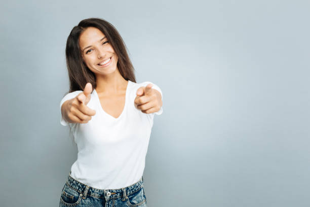 istock Positive delighted girl pointing at you 845490758