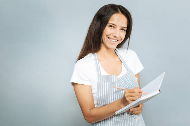 istock Portrait of delighted girl that making notes 845493156