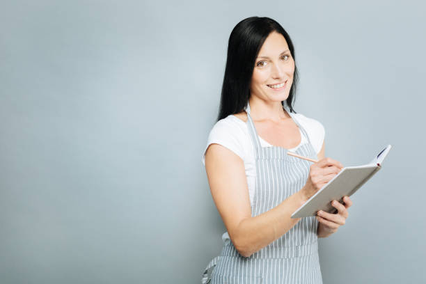 istock Happy female person making important notes 845493380