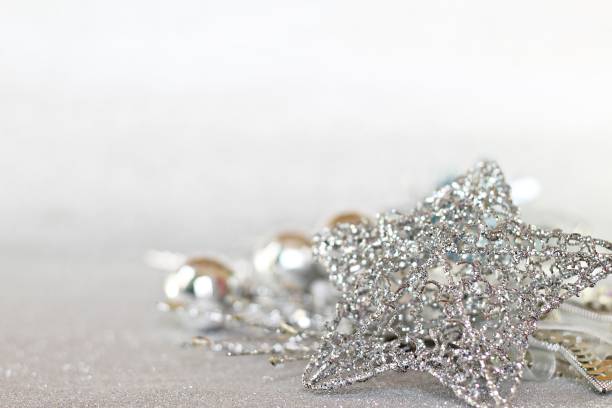 istock Star and shiny silver ornaments on bright abstract background bokeh, Top view or flat lay with copy space 845494428