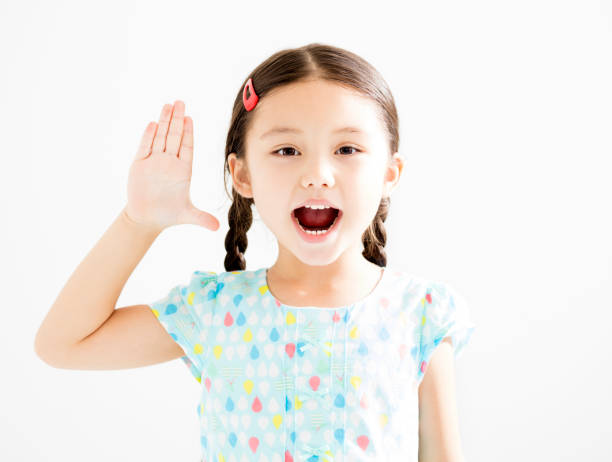 istock happy little girl with hands up 845494598