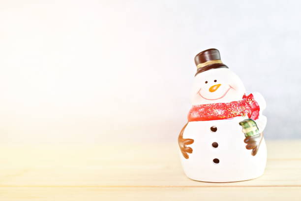 istock Santa Claus doll on wooden table and bright abstract background 845494930