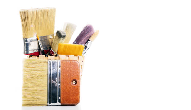 istock A group of large painting brushes, isolated on white background 845497156