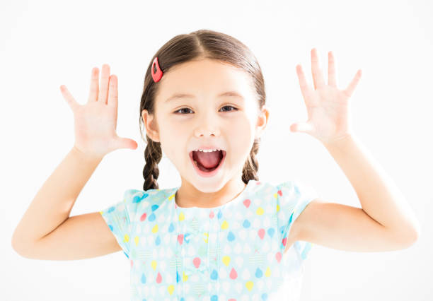 istock happy little girl with hands up 845497292