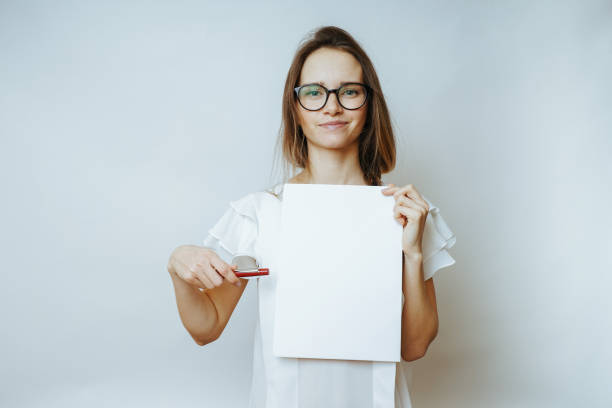 istock Woman with paper in hand,a4 845497794