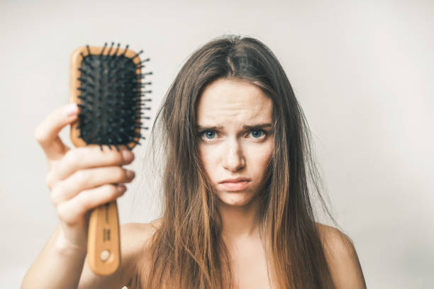 istock Problems with hair,lost hairs,woman with comb 845497924