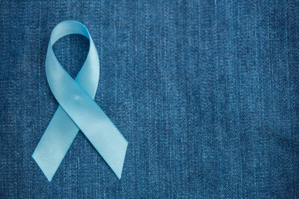 istock Blue ribbon for prostate cancer awareness on demin with copyspace 845498532