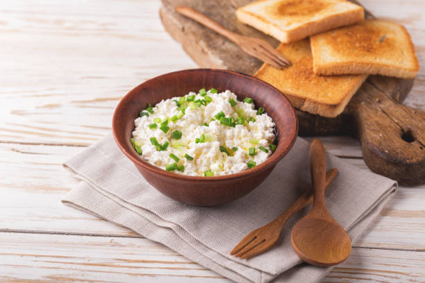 istock Goat cream cheese with green onions, dip sauce 845500876