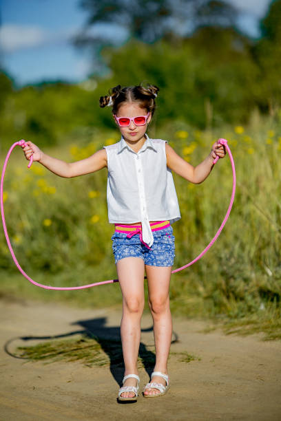 istock girl jumping with a rope 845500984