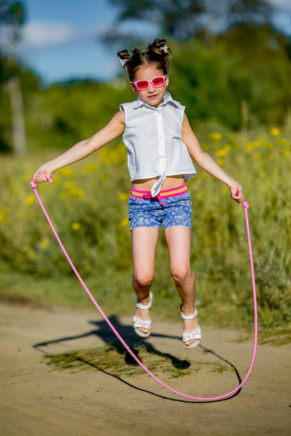 istock girl jumping with a rope 845501154