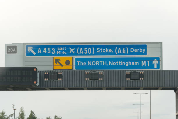 Sign on Motorway in England Sign for exit to Stoke, Derby and East midlands airport, also Nottingham and the North midlands england stock pictures, royalty-free photos & images