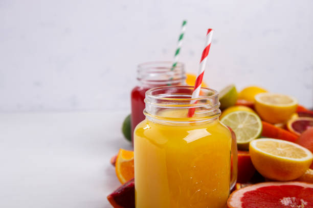 istock Juices Fresh Orange and Citrus on a White Background 845520718