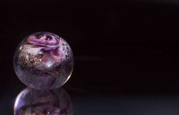 istock colourful violet red white sphere on black background with reflection isolated as modern abstract decorative healing object handcraft 845523428