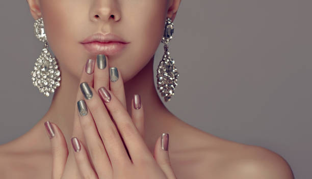 istock Stylish manicure and make up in a silver color. 845523762