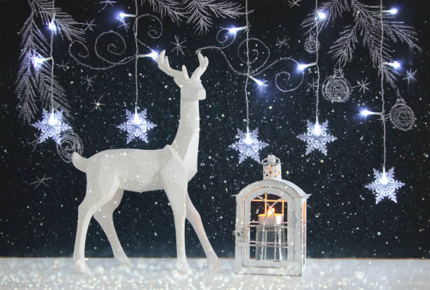 istock White reindeer on wooden table over chalkboard background whith hand drawn chalk illustrations 845523950