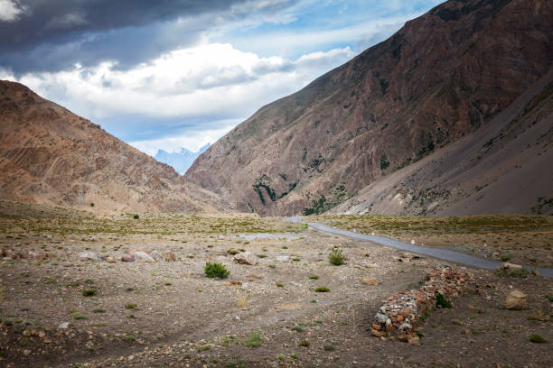 istock country road in between mountains 845530368