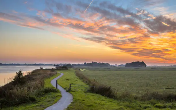 Photo of Polder landscape with winding cycling track