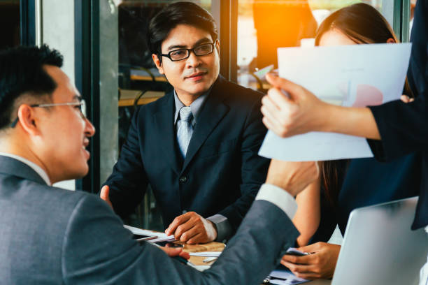 istock Asian business people meeting discussion working at office. 845537528