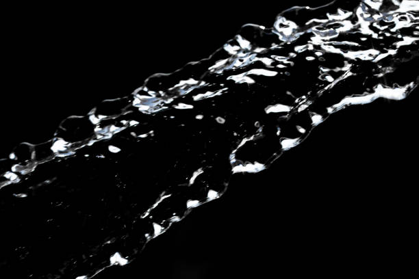 istock stream of water on a black background 845538036