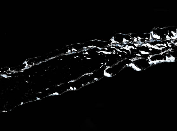istock stream of water on a black background 845538072