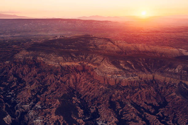istock Space landscape. A conceptual image of a distant cosmos and an uninhabited planet. Sunlight over the hilly terrain of the planet. 845538150
