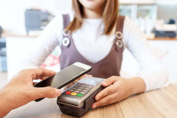 istock Man paying money via smartphone with magnetic card concept. 845538340