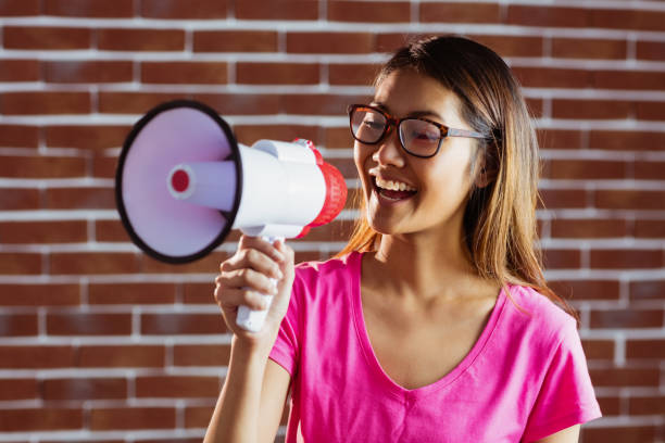 istock Asian woman shouting in megaphone 845542196