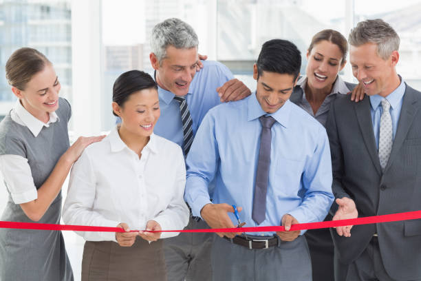 istock Business man cutting red strip 845542386