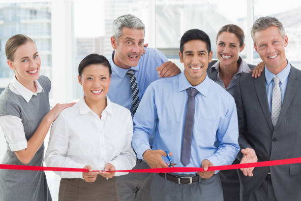 istock Business man cutting red strip 845542410