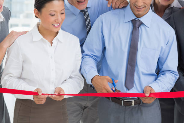 istock Business man cutting red strip 845542450