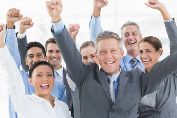 istock Business people cheering in office 845544622