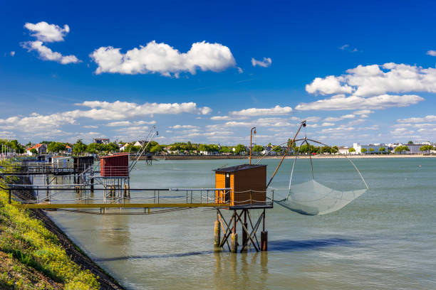 fishing huts and nets in st nazaire, france - fishing hut imagens e fotografias de stock