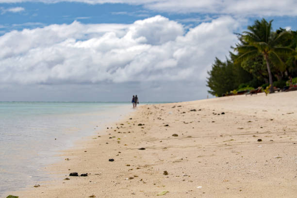 istock man and woman walking on polynesia beach 845545162