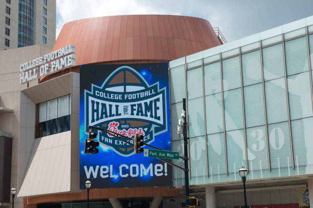 Building of the College Football Hall of Fame in downtown Atlanta Atlanta, USA - August 12, 2017. Building of the College Football Hall of Fame in downtown Atlanta, Georgia. College Football Hall of Fame is located on 250 Marietta St NW and a museum opened in 1951 to immortalize college football players and coaches. georgia football stock pictures, royalty-free photos & images