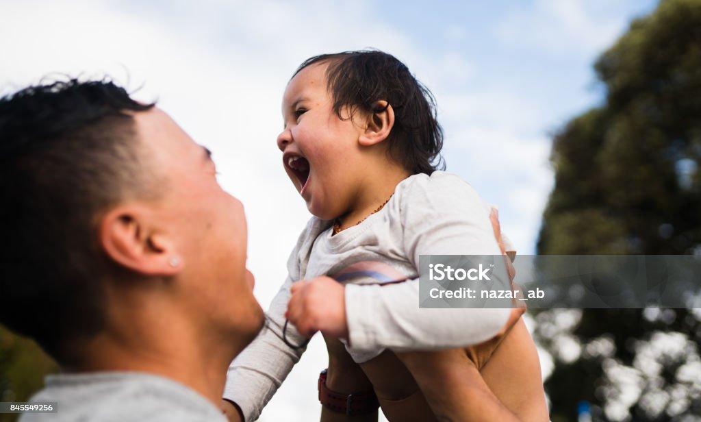 Families From New Zealand. Father enjoying light moment with his daughter. Māori People Stock Photo