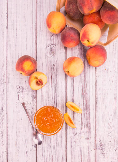 istock Peach Jam on wooden background; selective focus 845552644