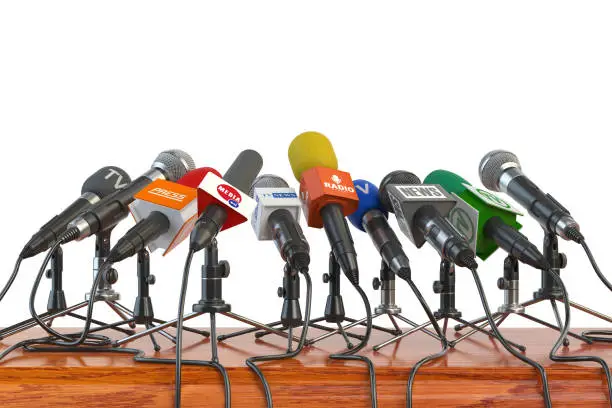 Microphones of different mass media, radio, tv and press prepared for conference meeting. Press conference or interview concept. 3d illustration