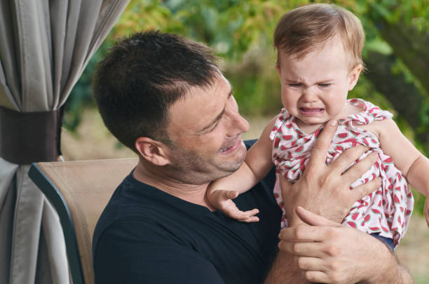 istock Father overwhelmed because his baby is crying. 845565922