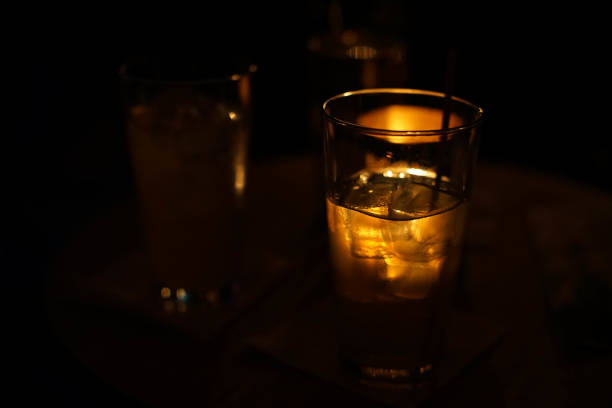 istock gin cocktail glowing from the lights in a dance club 845566288